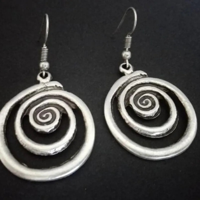 Retro geometric spiral distressed silver earrings showing 2.6cm width and 5cm length dimensions