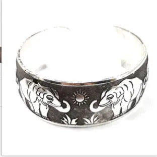 Silver alloy ethnic bracelet with carved Miao openwork patterns in turtle colour option