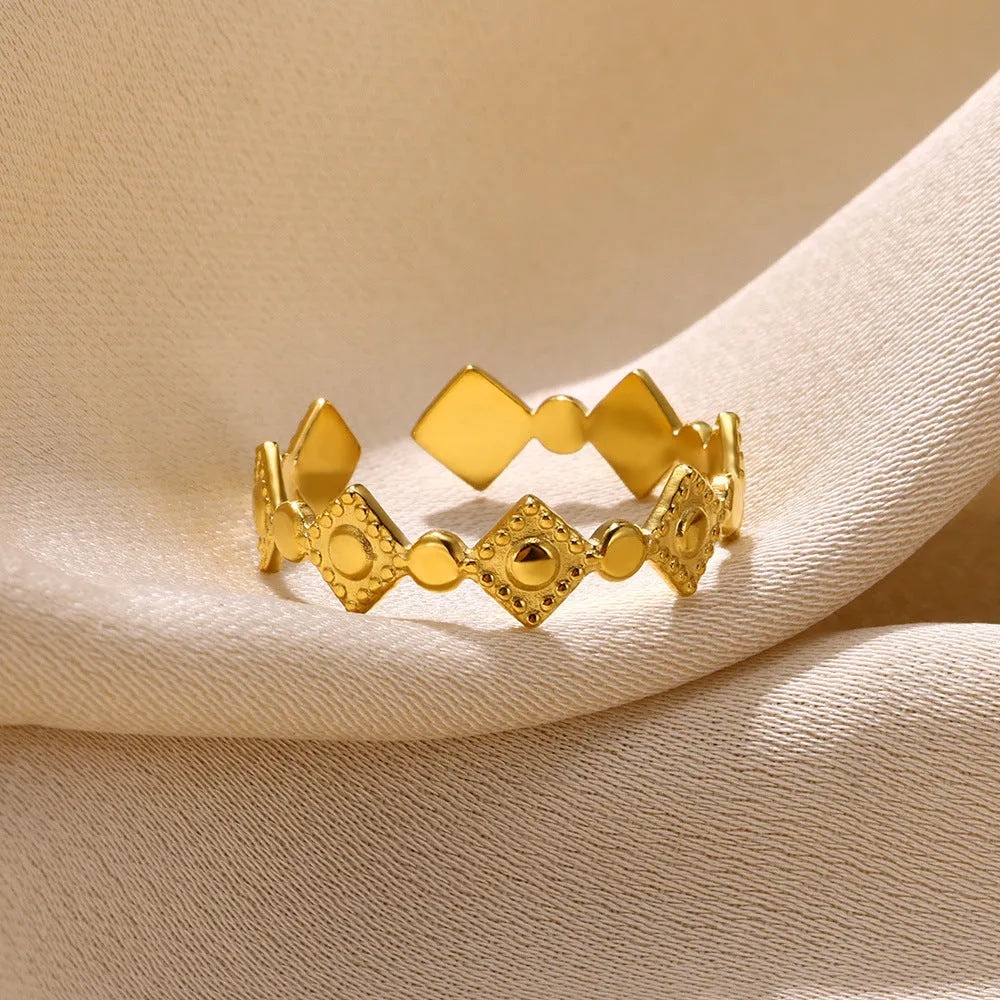Gold geometric titanium steel women's ring with diamond pattern detailing