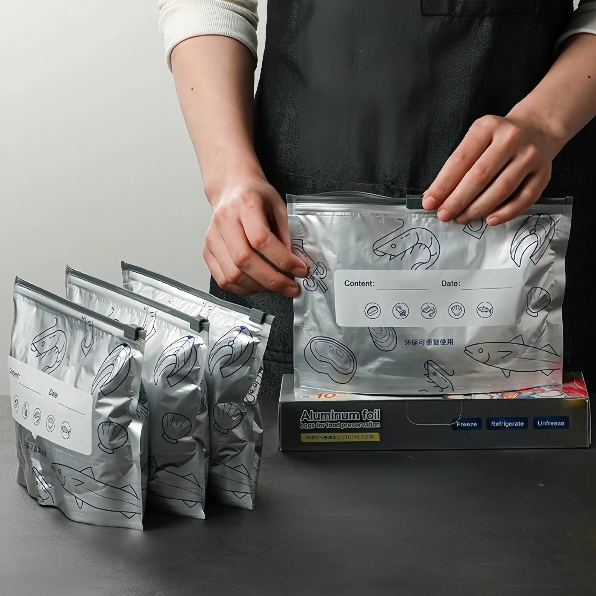 Pack of aluminium foil sealed food storage bags in small, medium, and large sizes.