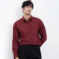 A man's wine red slim-fit casual long-sleeve shirt laid flat, showcasing its non-iron fabric.