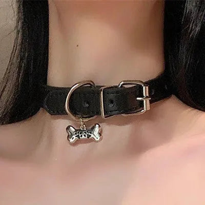 Black leather dog collar with bell pendant showing adjustable design from 21cm to 50cm perimeter