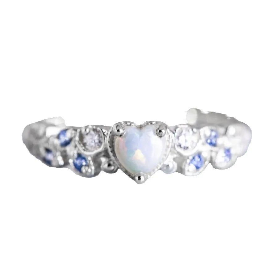 Women's peach-toned alloy heart ring with floral opal ocean pattern, shown in heart silhouette