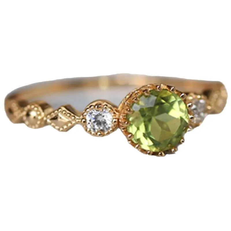 Japanese style copper ring with geometric quadrilateral shape and imitation peridot colour.