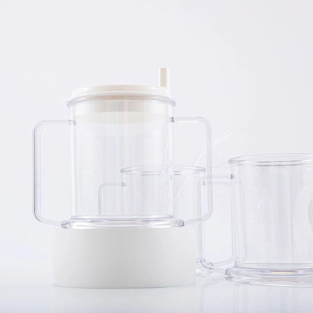 Transparent spill-proof drinking cup with lid on white background