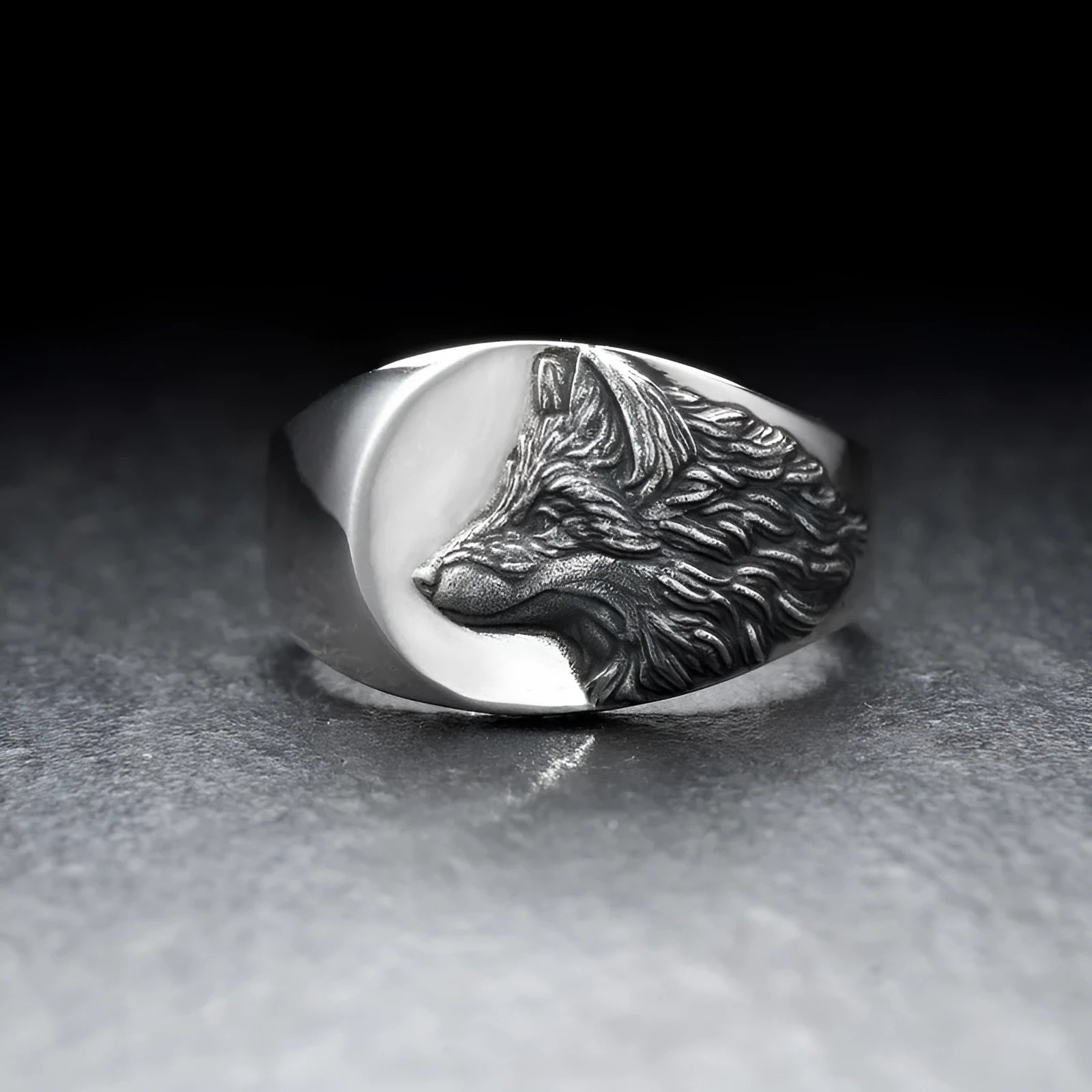 Men's geometric wolf head alloy statement ring in silver finish on a size guide showing options 6 to 12.