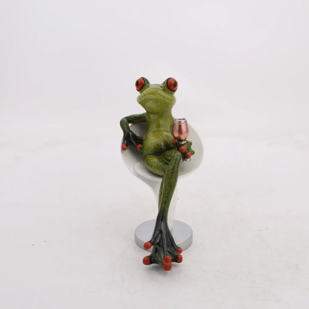 Synthetic resin pastoral style frog figurine home decoration ornament on a surface.