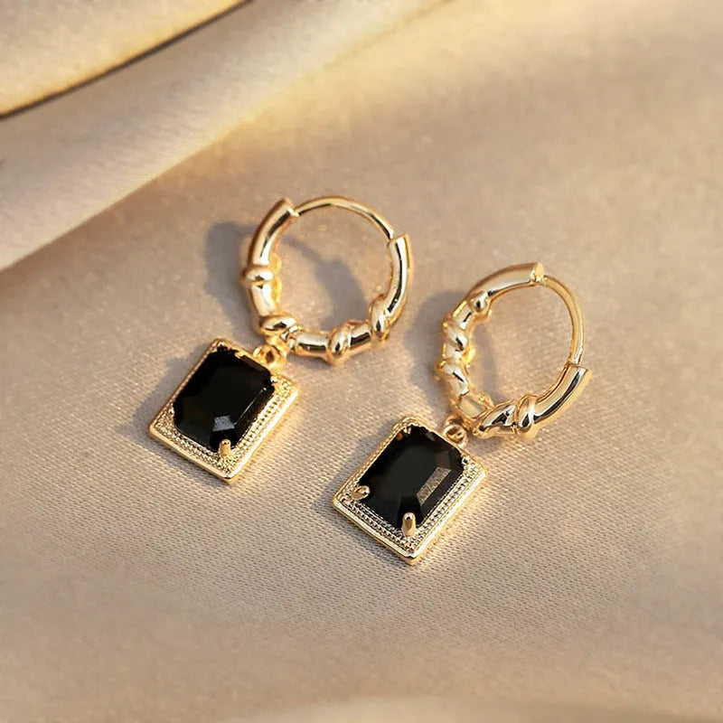 Geometric quadrilateral copper earrings with black zirconia centrepiece in French Court Retro style for women.