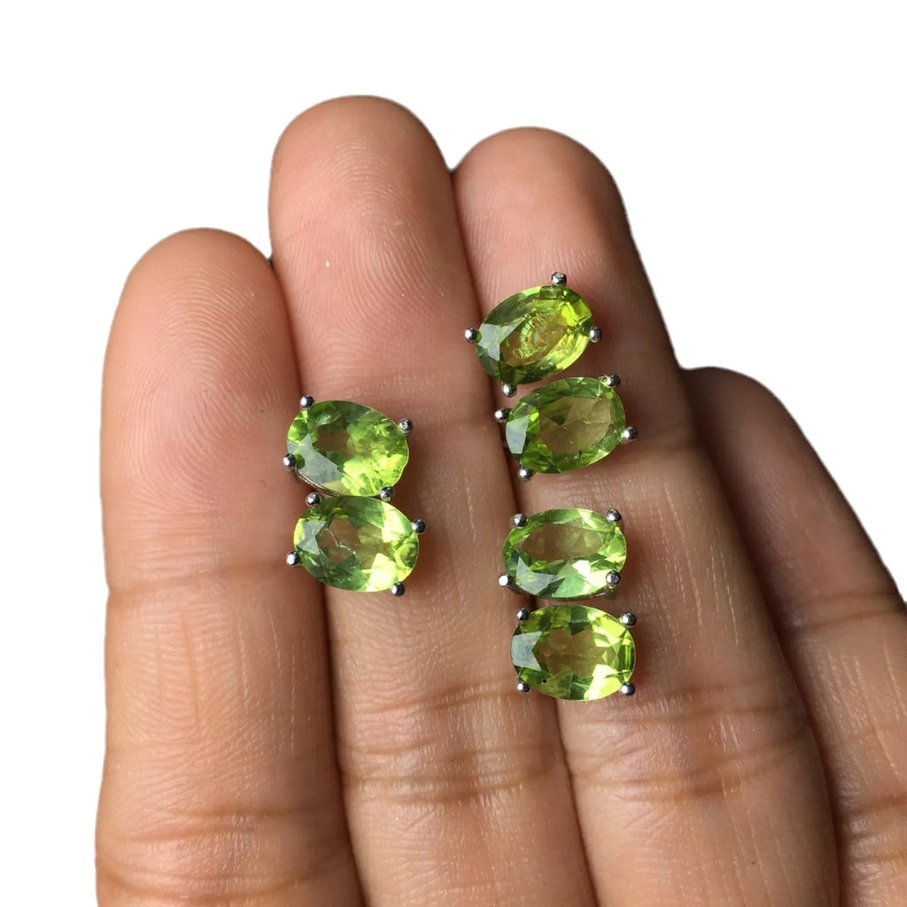 Grass green natural olivine stud earrings in sterling silver, elliptical stones 6x8mm.