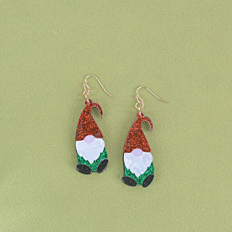 A pair of cartoon Santa Claus acrylic fashion earrings on a red background.