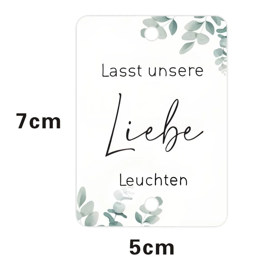 Pack of 50 white decorative paper labels with Fireworks and I Make Love print for events.
