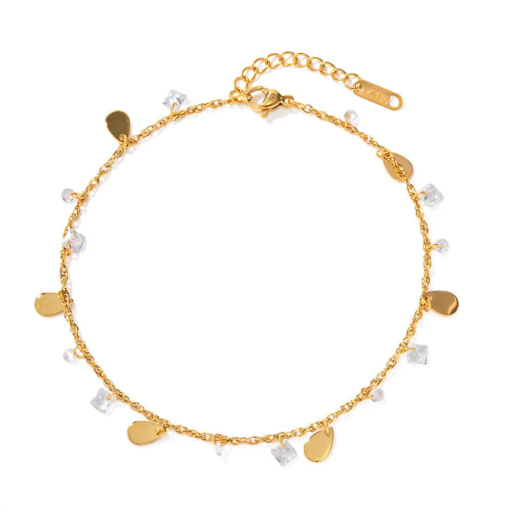 Women's stainless steel anklet with a silver water drop tassel charm and geometric links on an adjustable chain.