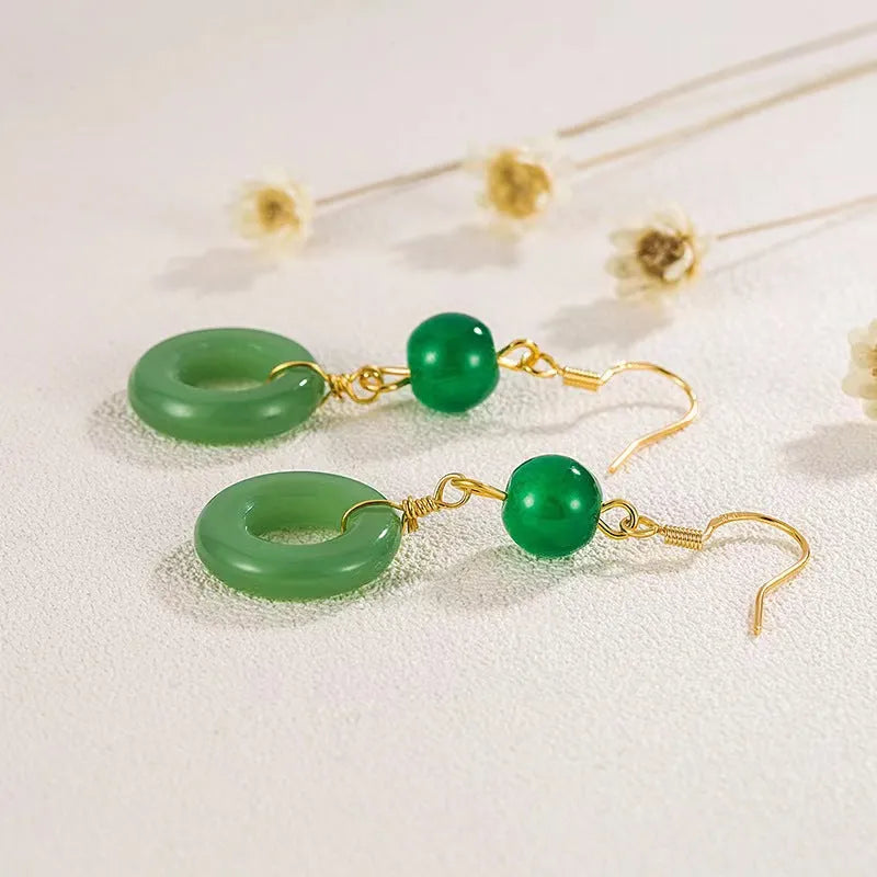 Green Chinese cheongsam peace buckle shape earrings with geometric design elements