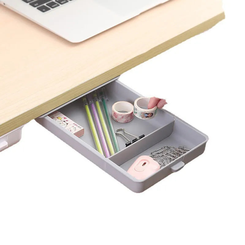 Small white plastic storage box with a lid and grid interior, mounted under a wooden table.