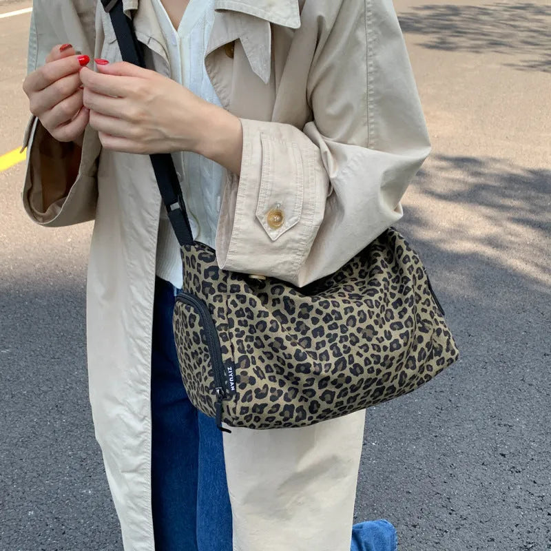 Leopard print sports messenger shoulder bag with stitching details