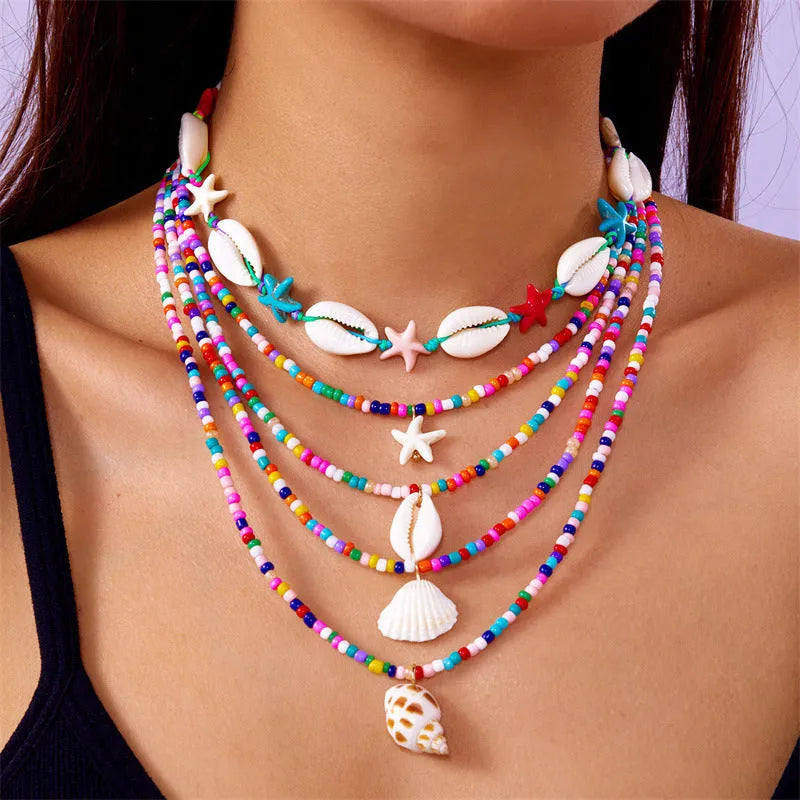 Five-piece women's necklace set with starfish shell and conch bead designs on electroplated alloy