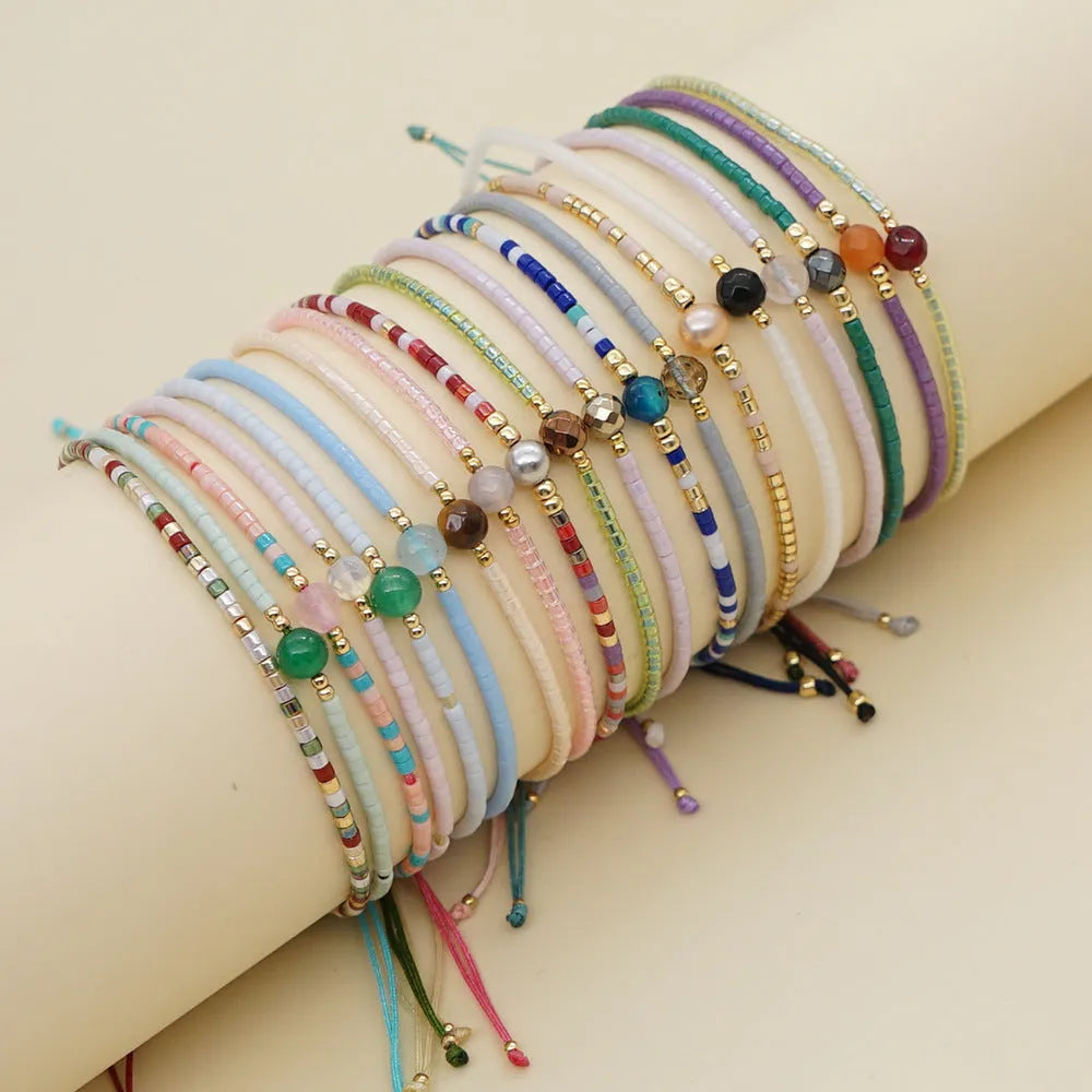 Handmade colourful beaded bracelet with semi-precious stones in bohemian geometric design.