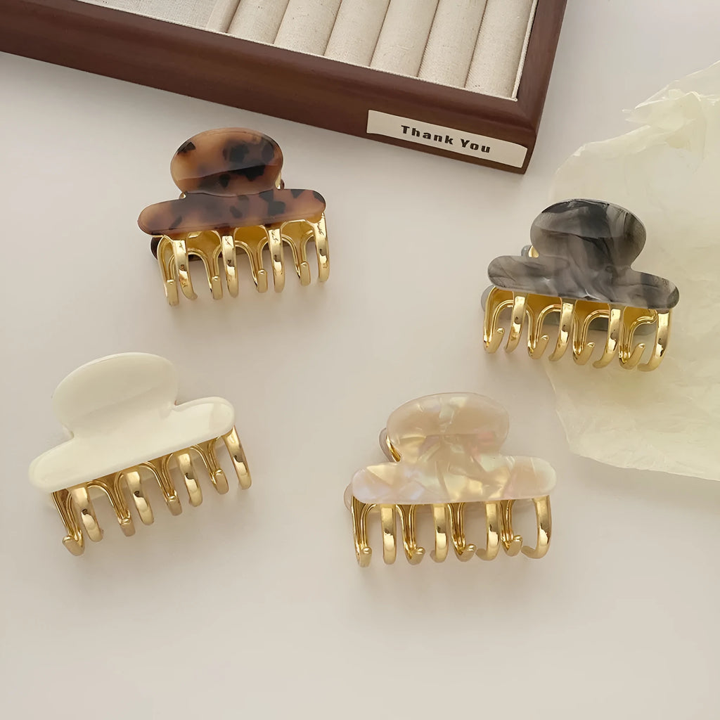 Women's retro acetate hair barrette with metal grip in leopard print pattern