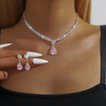 Claw chain necklace and earrings set with water drop rhinestones in blue colour