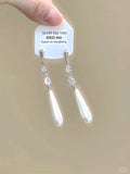 Geometric heart-shaped women's earrings with rhinestones, star charms and a dangling tassel.