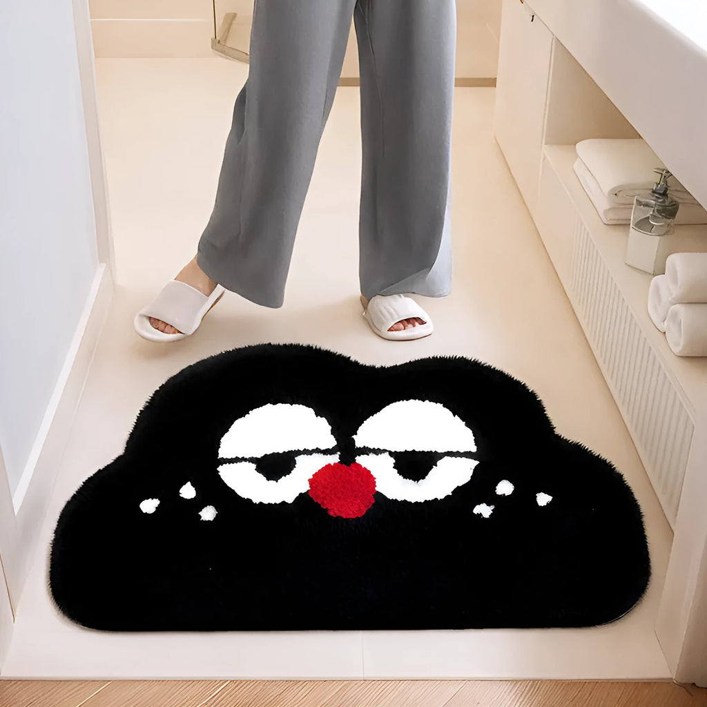 Cartoon anime Big Eye Clouds design bathroom mat in soft green colour on a bathroom floor.