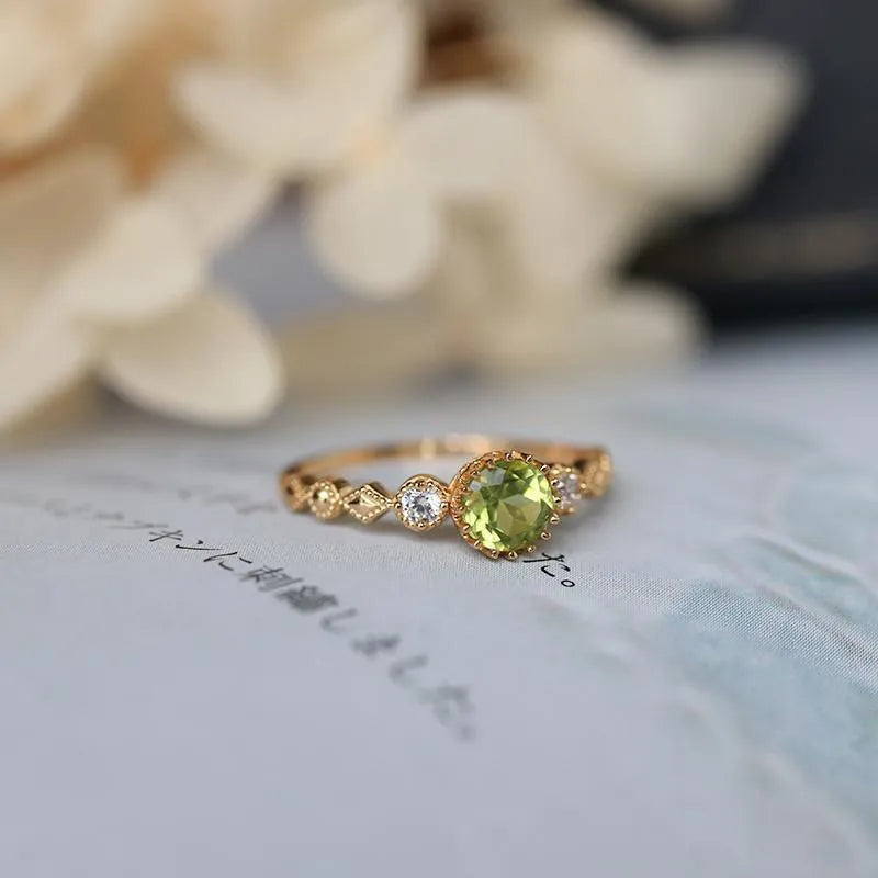 Japanese style copper ring with geometric quadrilateral shape and imitation peridot colour.