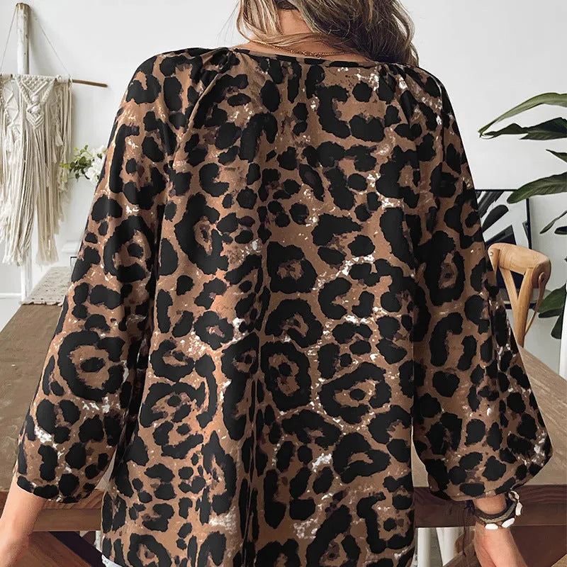 Women's leopard print V-neck pullover top with half sleeves and pleated detail