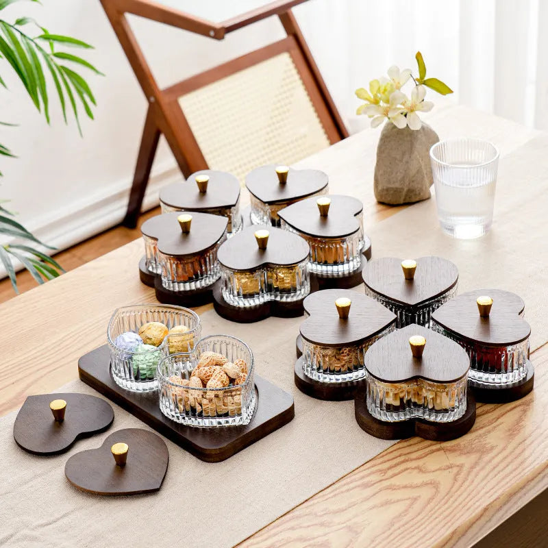 Glass fruit platter with transparent heart-shaped lids in compartmentalised serving tray