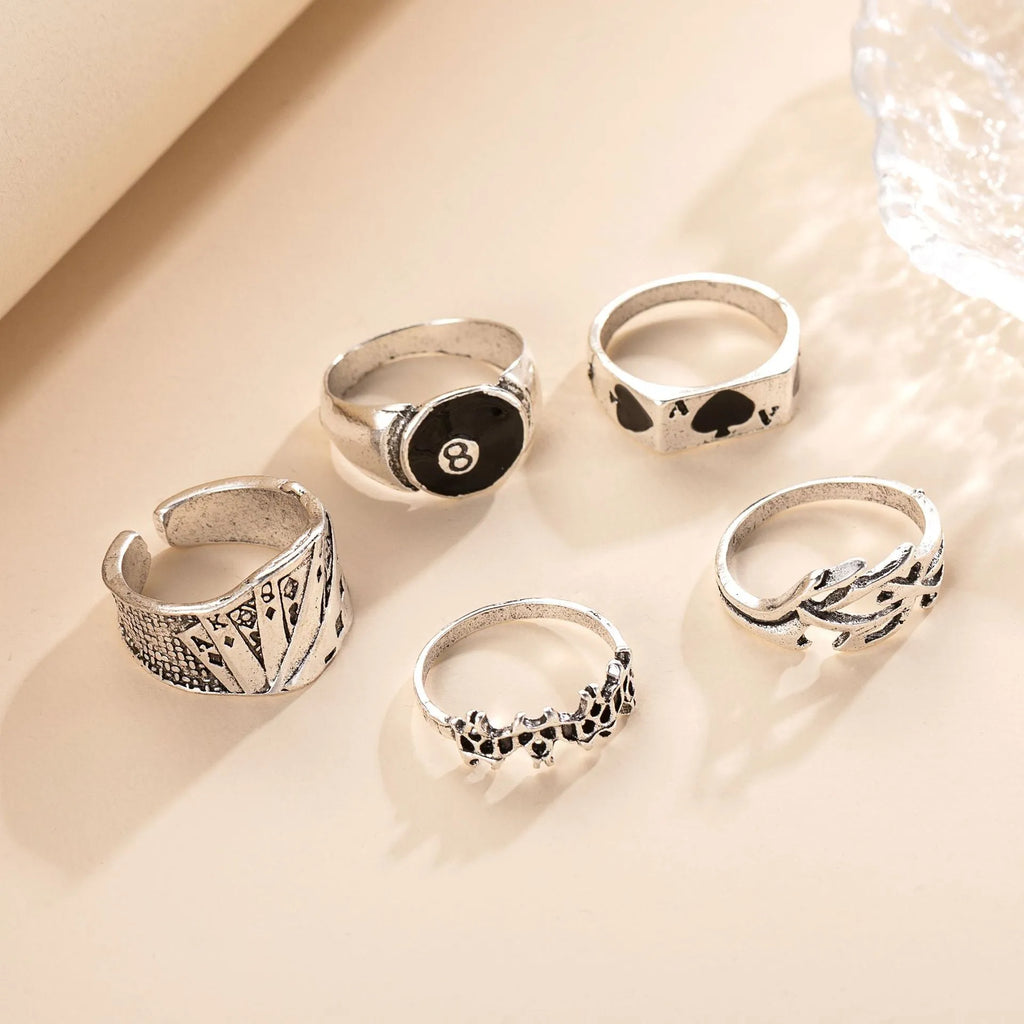Black alloy adjustable ring with a raised retro spade card symbol design.
