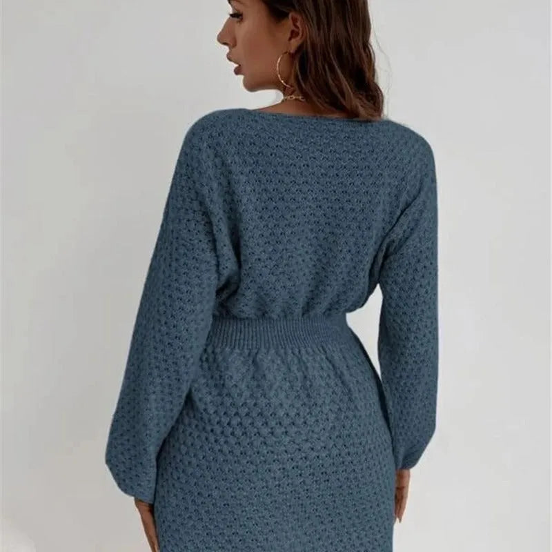 Blue women's knitted dress with hand crocheted floral details and fitted waist