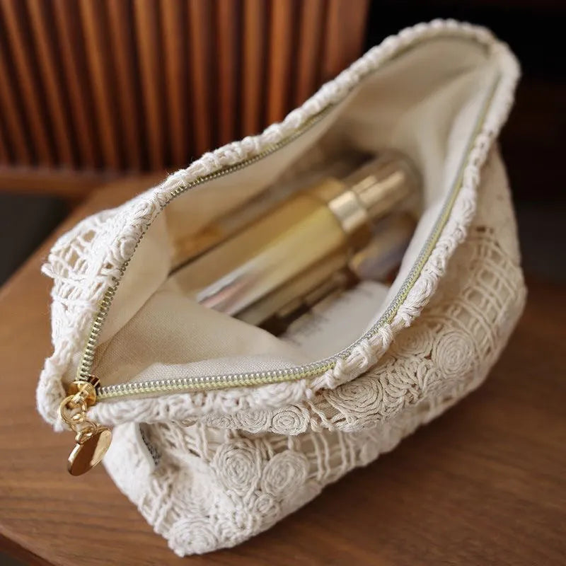 Handmade corduroy cosmetic bag with crocheted hollow flower embroidery