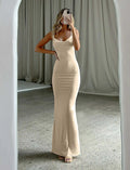 Backless milk silk dress with spaghetti straps and high waist hip skirt in champagne colour