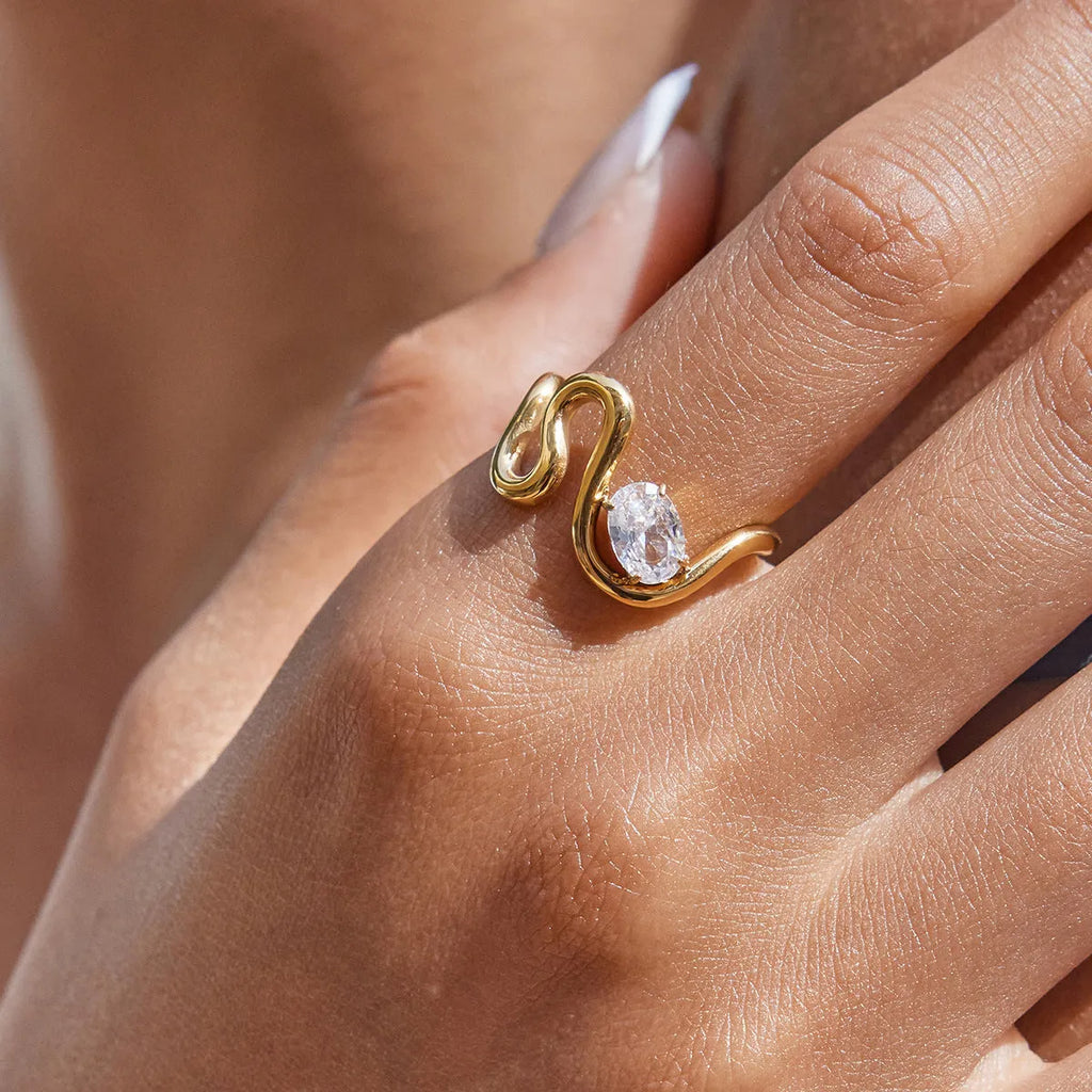 Geometric stainless steel zircon ring on a grey background showing European and American style.