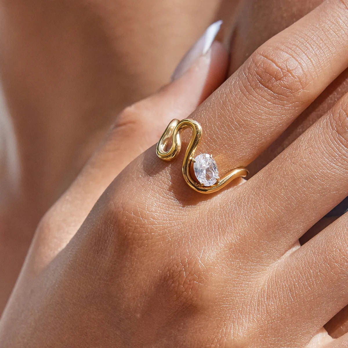 Geometric stainless steel zircon ring on a grey background showing European and American style.