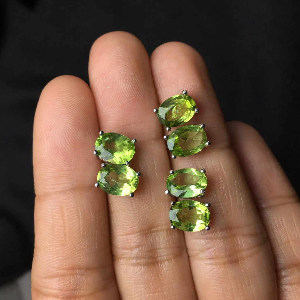 Grass green natural olivine stud earrings in sterling silver, elliptical stones 6x8mm.