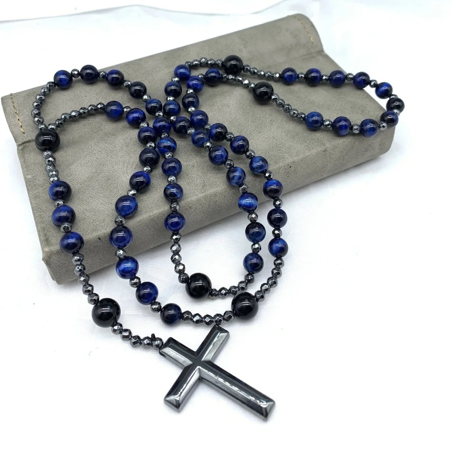 Men's stone cross pendant necklace with ball bead chain and safety lock clasp in geometric design.