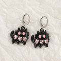 Women's alloy earrings with cross crystal design in five colour options including white, black cat, and antique silver