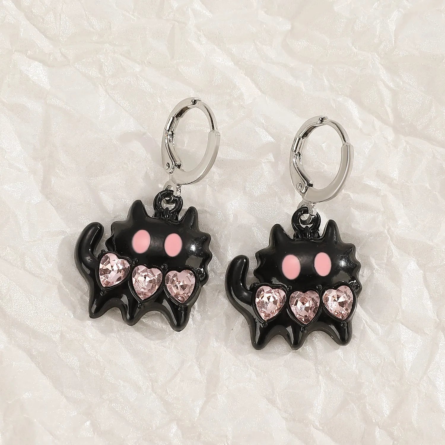 Women's alloy earrings with cross crystal design in five colour options including white, black cat, and antique silver
