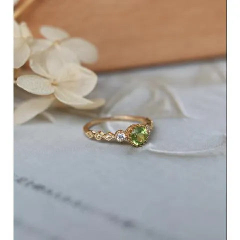 Japanese style copper ring with geometric quadrilateral shape and imitation peridot colour.
