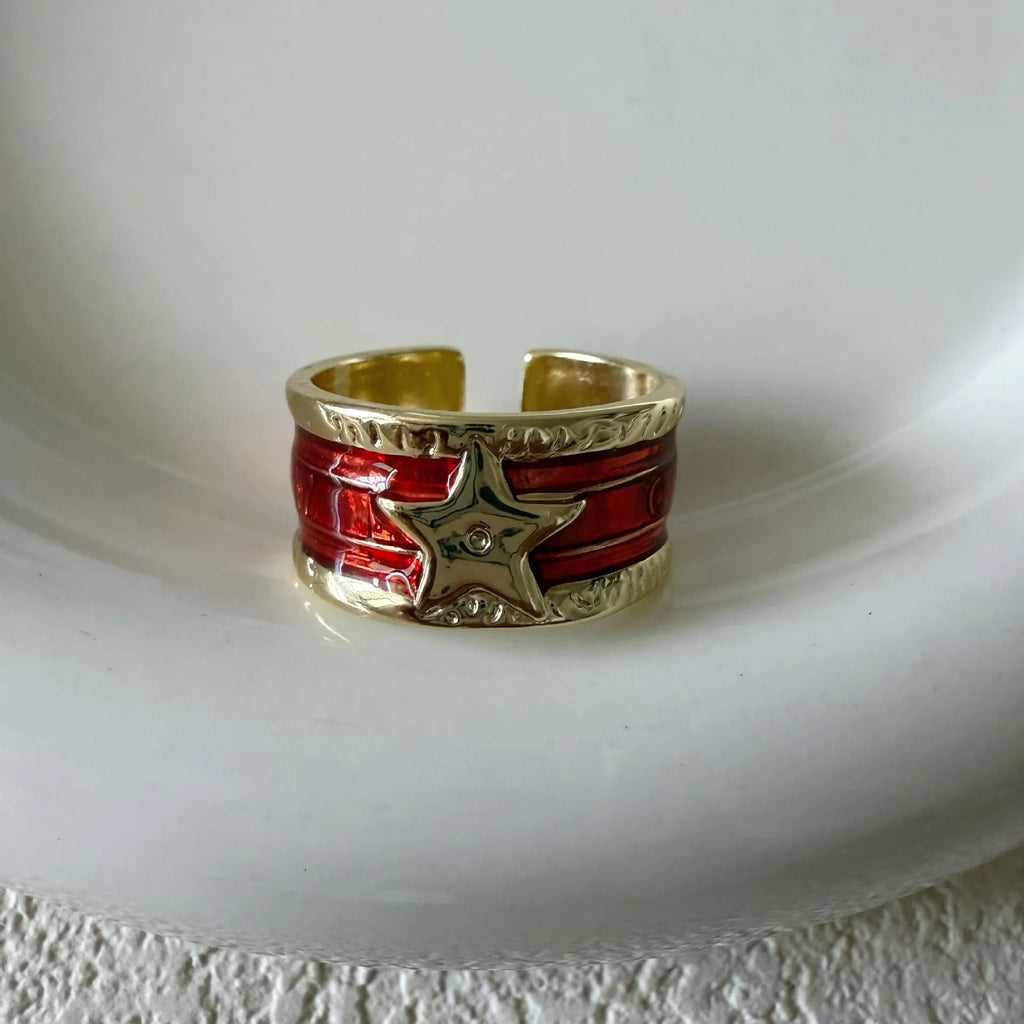 Adjustable geometric women's ring with a retro distressed XINGX drop oil design in copper.