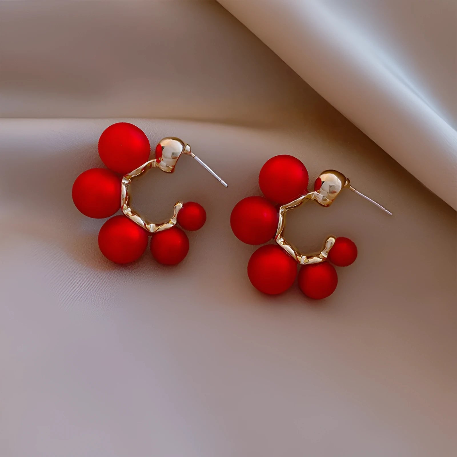 Red bell-shaped alloy earrings for women, also available in white.