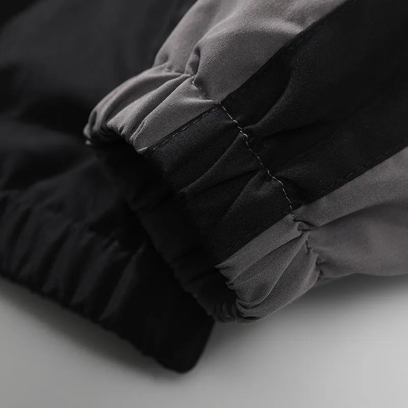 Men's black casual jacket with contrast stitching detail and side pockets, shown in loose fit for spring and autumn wear