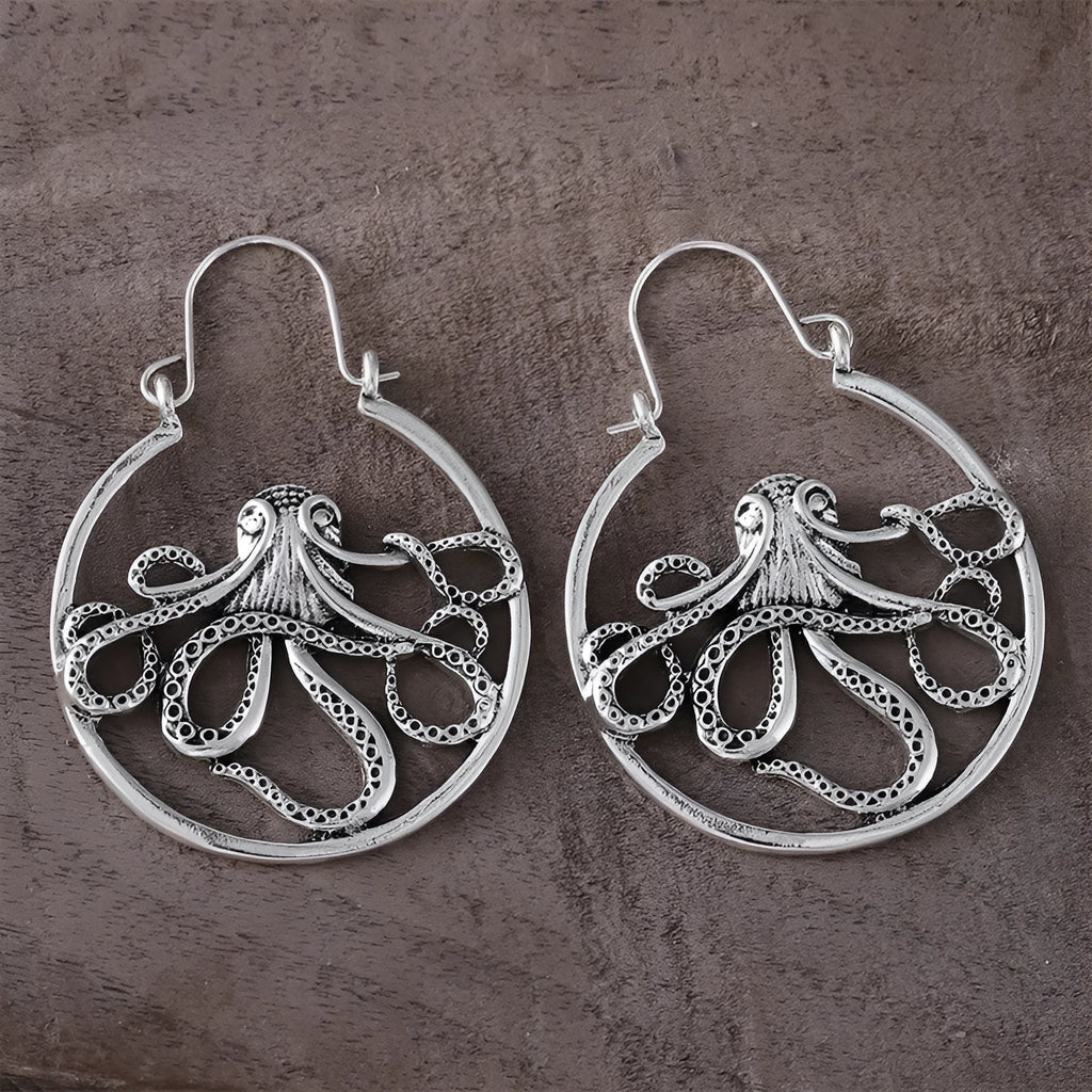A pair of vintage-style octopus-shaped earrings in an antique silver colour.