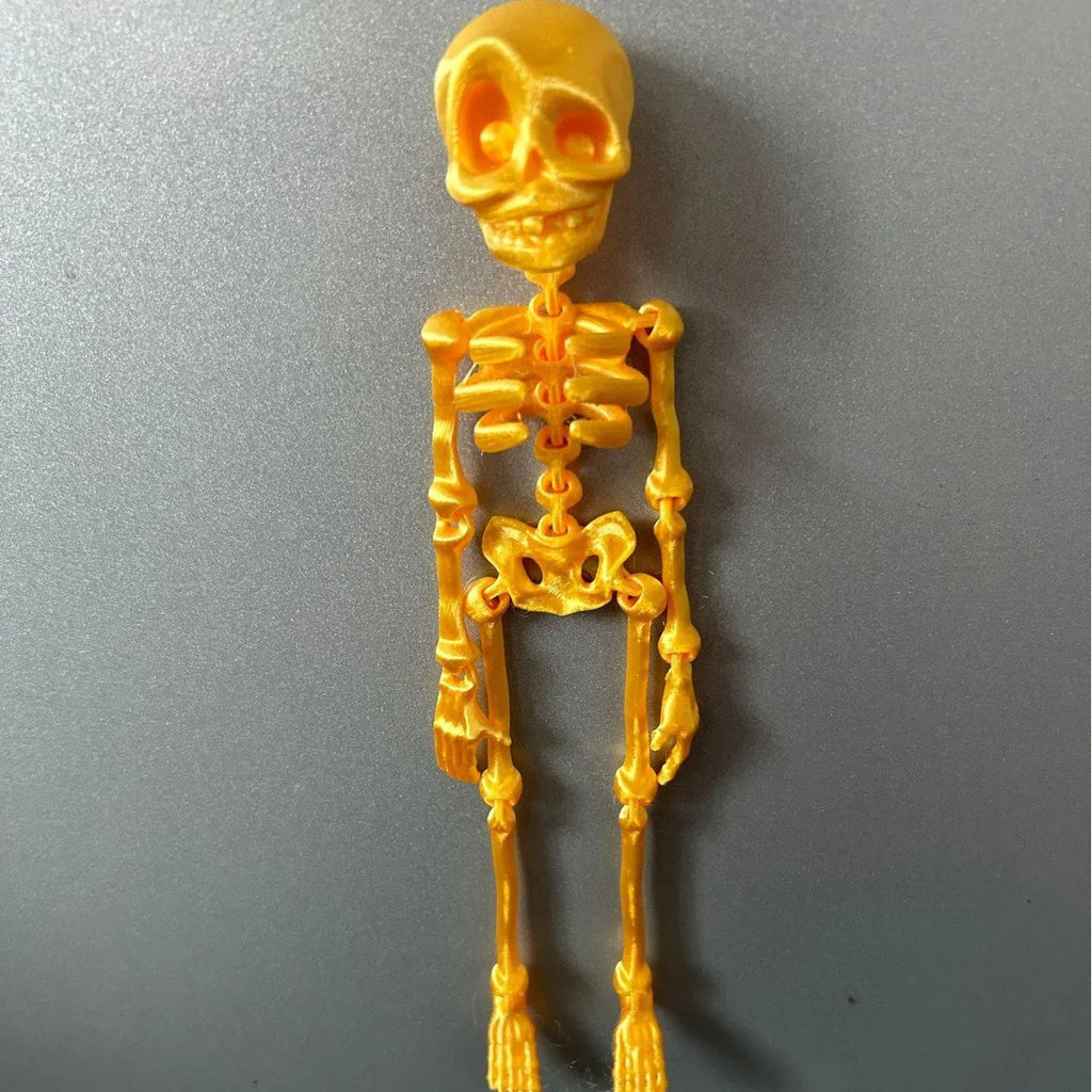 3D printed skull refrigerator magnet ornament measuring 18cm high by 4.5cm wide in multiple colour options