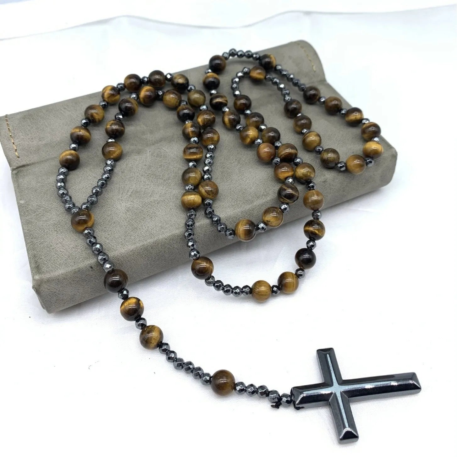 Men's stone cross pendant necklace with ball bead chain and safety lock clasp in geometric design.