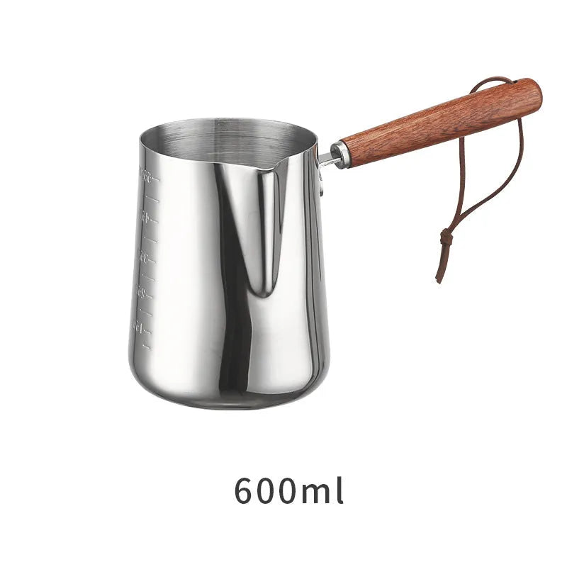 Stainless steel coffee cup with wooden handle showing interior measurement scale markings