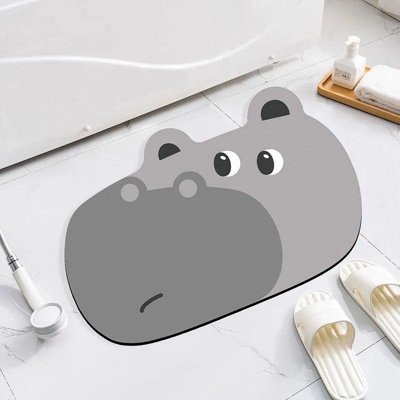 Cartoon animal design diatom oil bathroom mat in alien shape on bathroom floor.