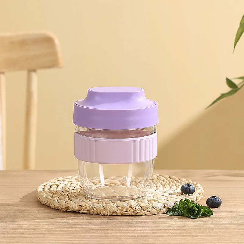Green plastic salad cup with integrated spoon in lid, shown with leak-proof seal.