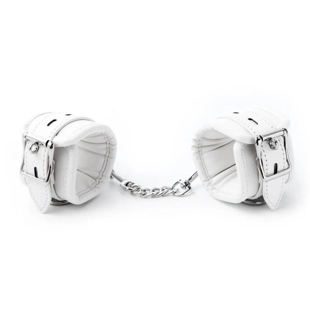 White PU sponge bondage cuff set showing handcuffs, footcuffs and neck cuff for restraint play
