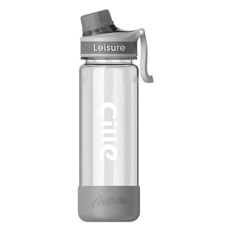Plastic drinking cup with cartoon pattern in grey, green and pink colours showing three capacity options